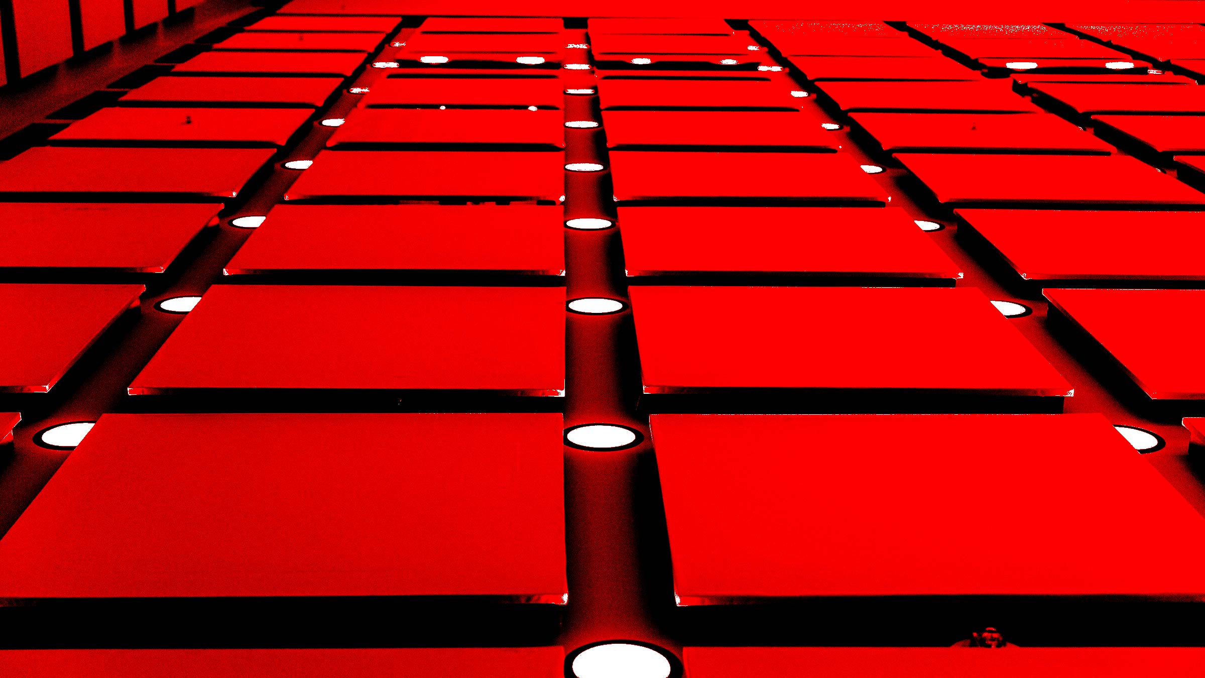 Red repeating ceiling tile grid pattern